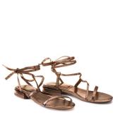 Metallic sandalen, enkellint en platte hak