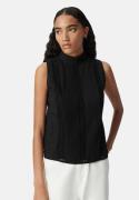 Blouse plissée sans manches à col montant